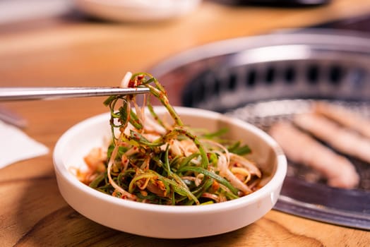 Spicy Kimchi group. Korean pickle or Pickled radish vegetables set and seasoning on bowl on stove serve wood table background, Japanese food