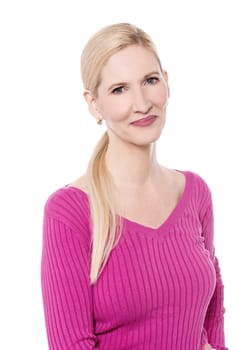 Casual middle aged woman posing over white