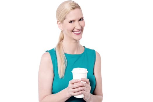 Smiling woman posing with disposable cup