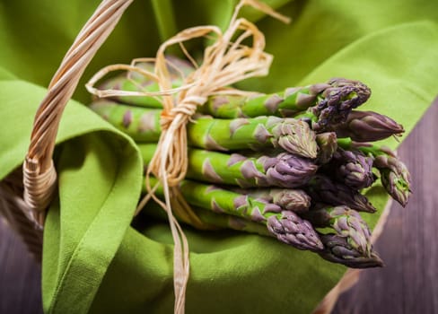 Fresh green asparagus in basket