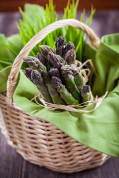 Fresh green asparagus in basket