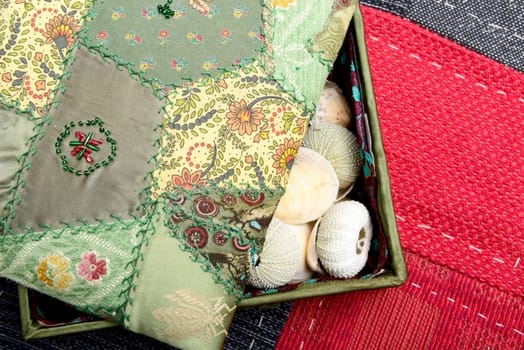 pretty box in fabric with several seashells