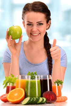 Young woman with variety of vegetable and fruit juices. Detox diet.