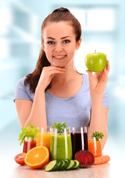 Young woman with variety of vegetable and fruit juices. Detox diet.