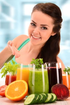 Young woman with variety of vegetable and fruit juices. Detox diet.