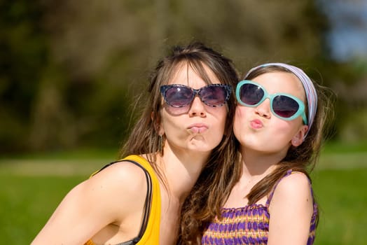 portrait of a mother and daughter with sunglasses