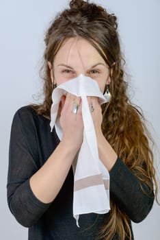 a young woman has a cold