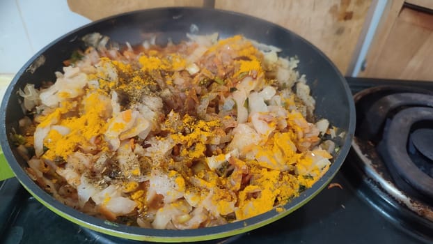 meat vegetables stewed onion frying pan food home cooking stove cooking recipe dish dinner lunch delicious, horizontal format photo. High quality photo
