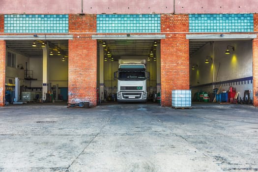 Truck or lorry in repair shop service garage