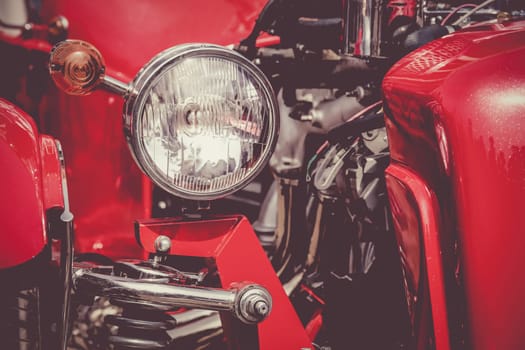 Old retro or vintage car or automobile front side with front light or headlight. Processed by vintage or retro effect filter