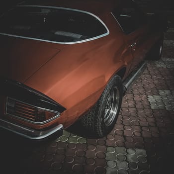 Old retro or vintage car or automobile back side with back light or taillight. Processed by vintage or retro effect filter
