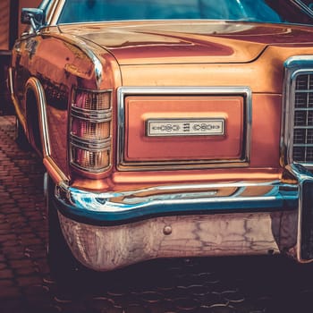 Old retro or vintage car or automobile front side with front light or headlight. Processed by vintage or retro effect filter