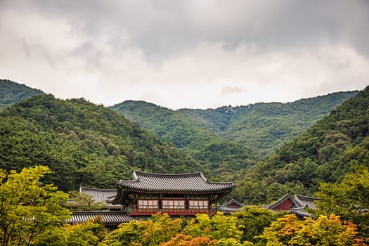 Traditional asian buddhist monks temple in mountains in South Korea at autumn