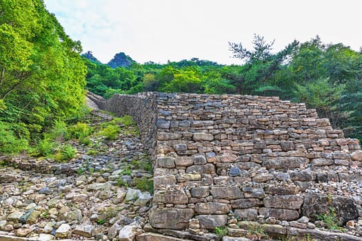 Big and long old stone wall old monument landmark in national park in South Korea