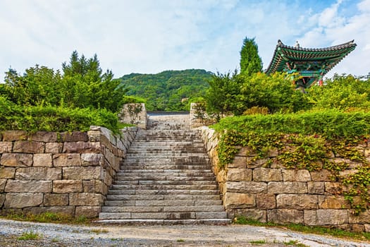 Wall from stones with stairs to monk temple in South Korea
