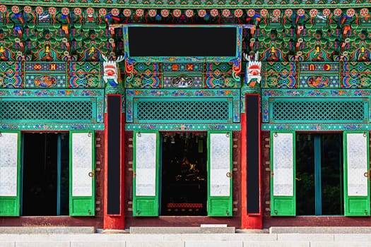 Entrance to buddhist monks temple with traditional decorative patterns in South Korea