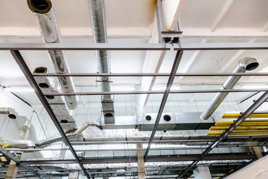 Rooftop with pipes of industrial building under construction