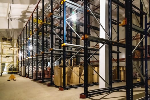 Warehouse interior with empty shelves on factory or plant