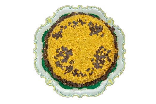 Top view of homemade lemon cake with almonds and chocolate flakes with space for your design. Birthday, wedding, anniversary or other festivals. Clipping path.
