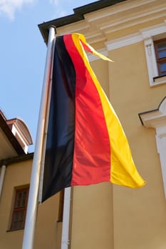 Flag of the Federal Republic of Germany in front of a ministry in Magdeburg