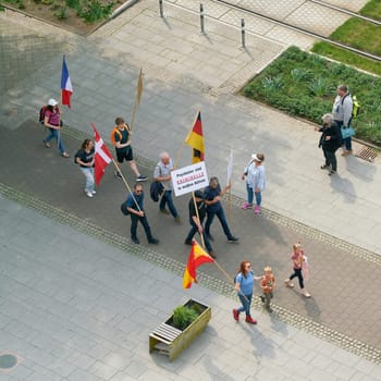 Protest against the Congress of German Child and Adolescent Psychiatry in Magdeburg. Translation on the sign: Psychiatrists are criminals in white coats