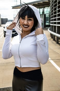 Young cute black hair woman posing with stylish Hoodie