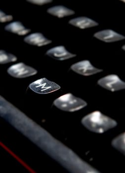 1970s dusty typewriter. Selective focus on key M