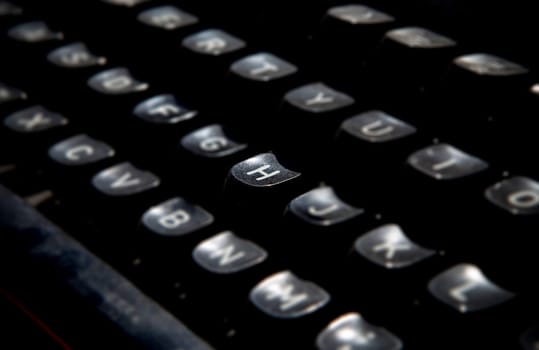 1970s dusty typewriter. Selective focus on key H