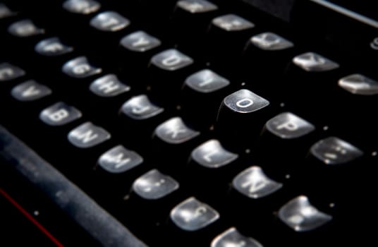 1970s dusty typewriter. Selective focus on key O