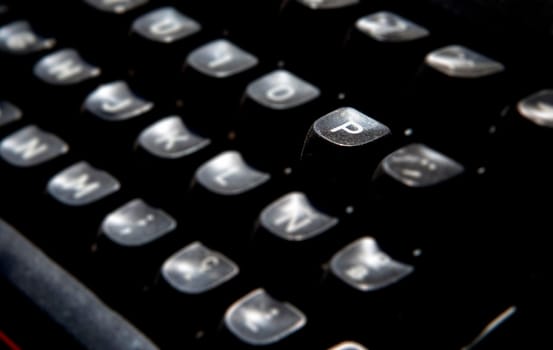 1970s dusty typewriter. Selective focus on key P