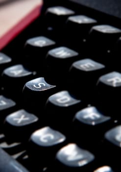 1970s dusty typewriter. Selective focus on key S