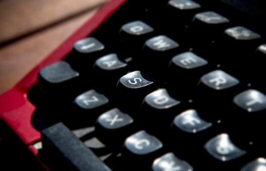 1970s dusty typewriter. Selective focus on key S