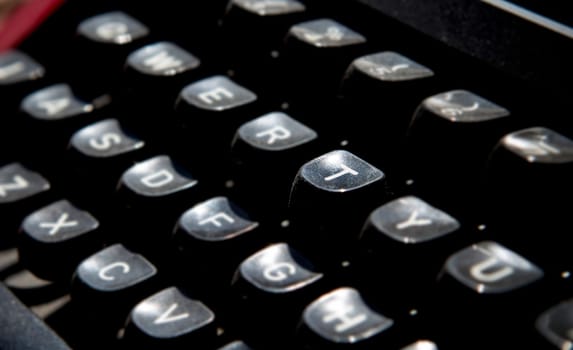 1970s dusty typewriter. Selective focus on key T