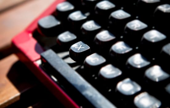 1970s dusty typewriter. Selective focus on key X