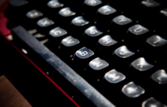 1970s dusty typewriter. Selective focus on key B