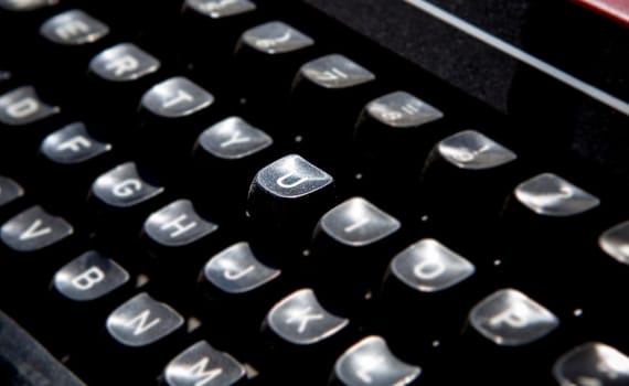 1970s dusty typewriter. Selective focus on key U