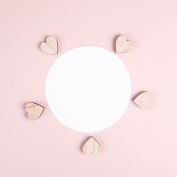 Pastel colored greeting card, white circle with copy space for text and hearts, valentines day, mothers day background, romantic layout, love concept