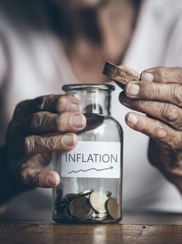 Elderly retired woman and her savings in a jar