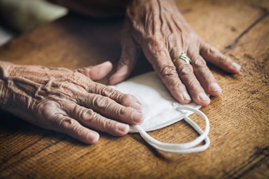Elderly woman with a face mask during lockdown