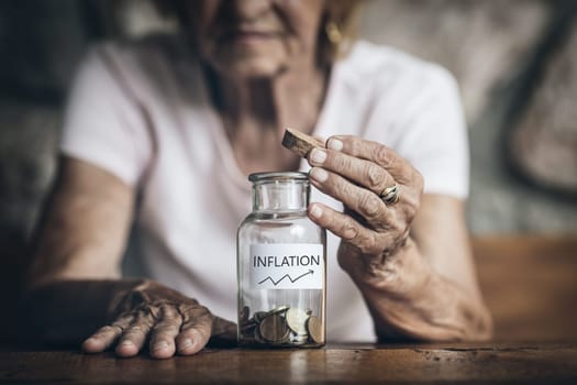 Elderly retired woman and her savings in a jar