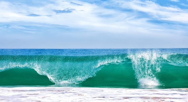 Big wave in ocean with blue sky, panoramic image