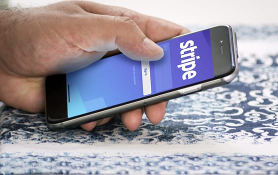 San Francisco, CA, USA, March 15, 2022: Stripe mobile application login page on the screen of a hand held smartphone. Stripe is an American financial services company