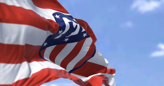 Madrid, Spain, May 2022: The flag of Atletico Madrid waving in the wind on a clear day. Atletico Madrid is a Spanish professional football club based in Madrid