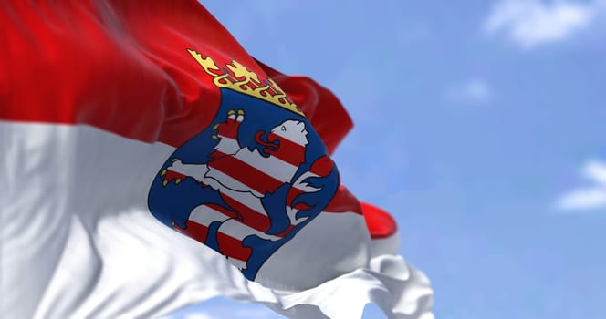 The flag of Hesse waving in the wind on a clear day. Hesse is a state in Germany. Its capital city is Wiesbaden, and the largest urban area is Frankfurt