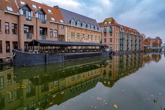 Urban scene, old buildings along the canal in Bruges, Flanders, Belgium