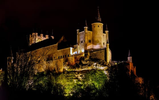 Alcazar of Segovia as the famous landmark at night in Spain