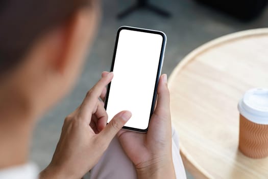 close-up a woman holding and touch smartphone blank screen
