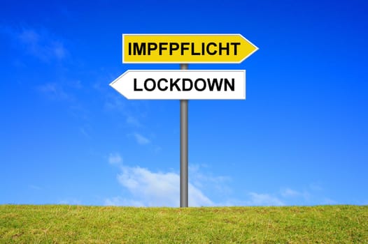 Signpost outside is showing Lockdown and Mandatory Vaccination in german language