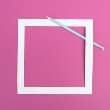 Pencils on a pink paper background, white frame with copy space for text, minimalism, creative and business concept, pastel colored