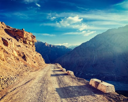 Vintage retro effect filtered hipster style image of road in Himalayas. Spiti Valley, Himachal Pradesh, India